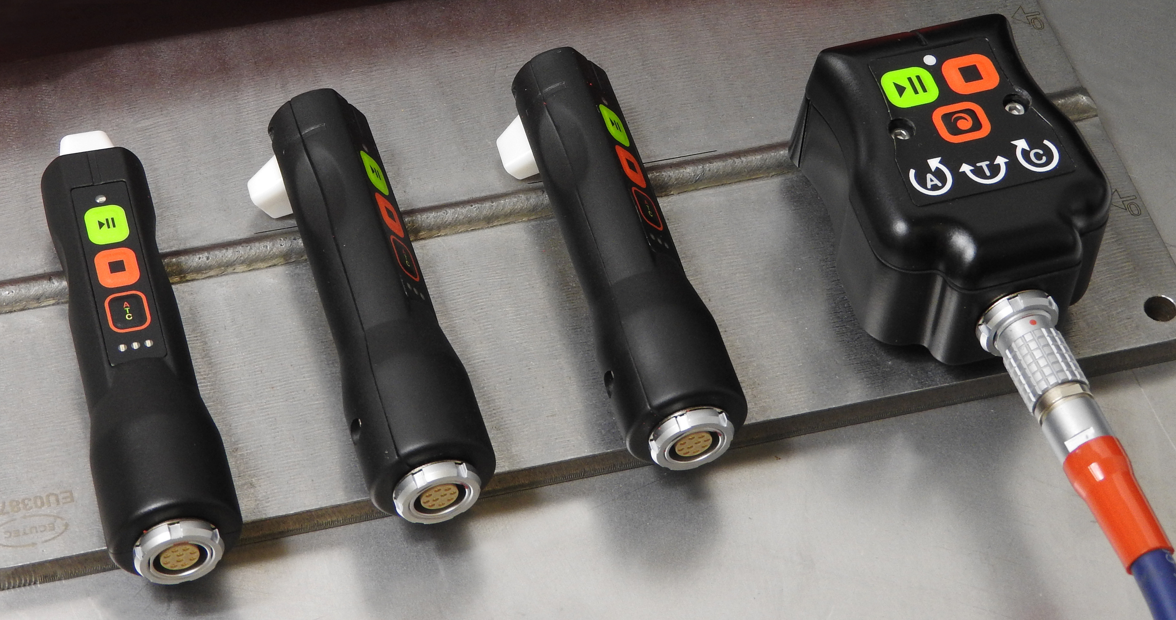 Handheld Encoders for Eddy Current Scanning Handheld encoder scanners with control buttons used for eddy current testing on a weld seam